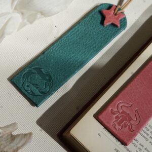Red and turquoise leather zodiac bookmarks with star detail