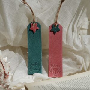 Red and turquoise leather zodiac bookmarks with star detail